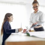 teacher helping student with mistake