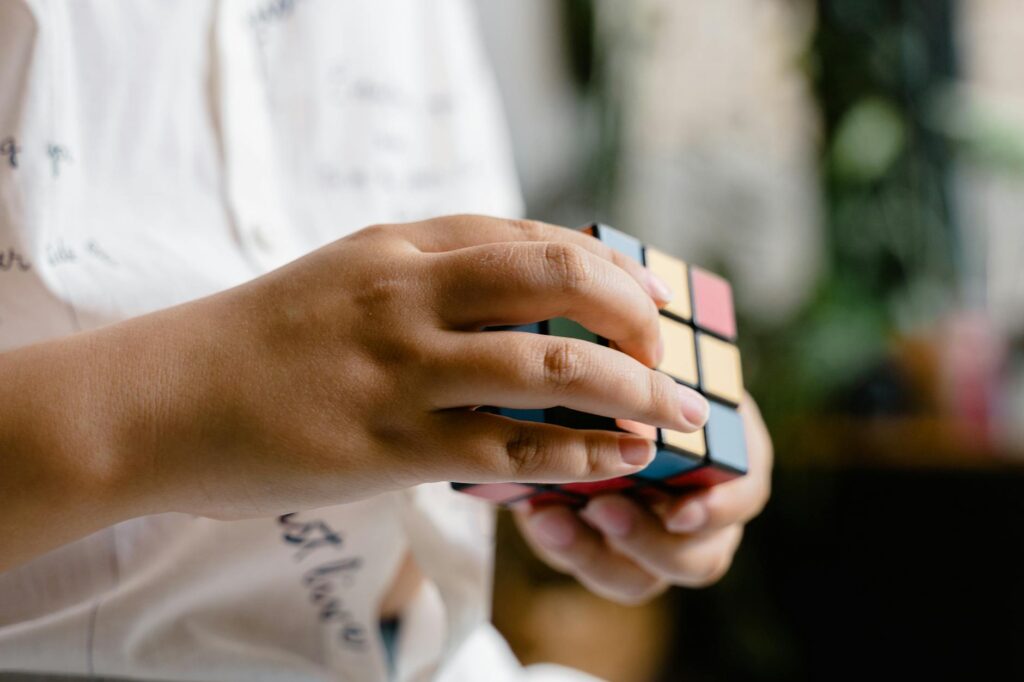 child solving puzzle