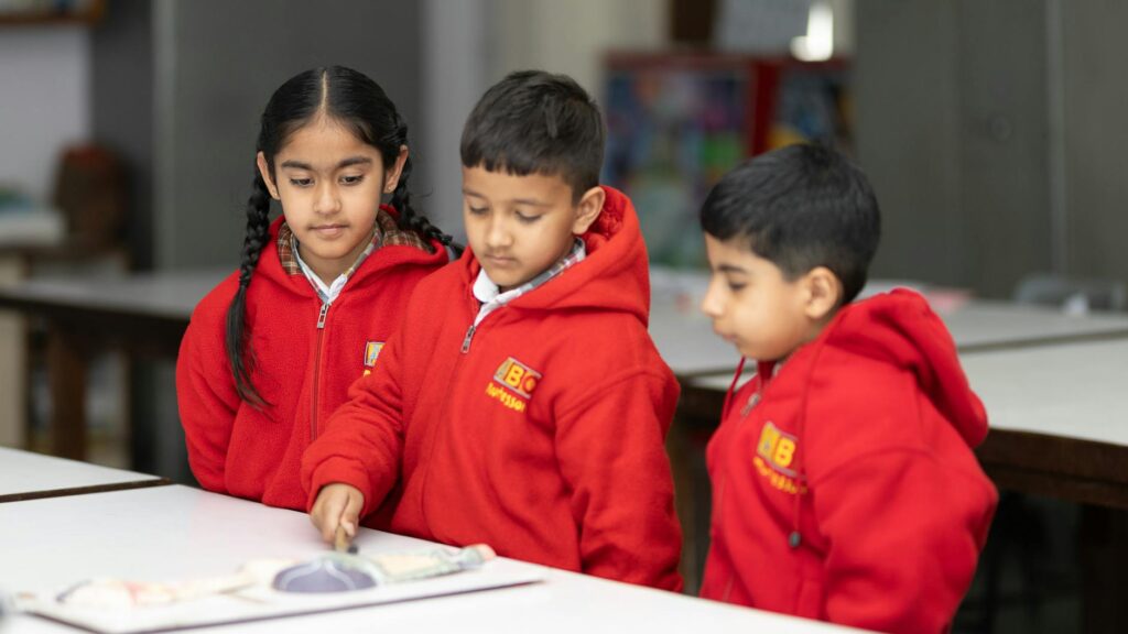 primary students engaged in classroom activity