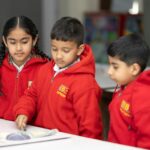 primary students engaged in classroom activity