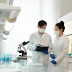 scientist analyzing painting with scanner