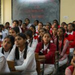 students wearing classroom headphones