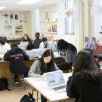 students working in classroom jobs