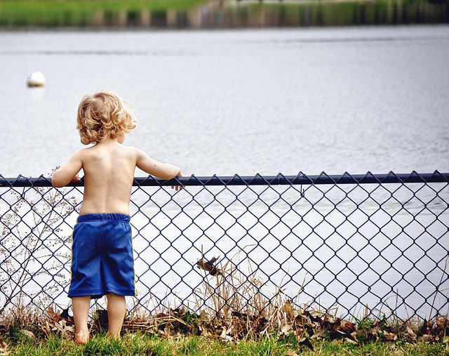 Child looking thoughtfully at a list of diverse writing prompts. (creative writing prompts for kids)