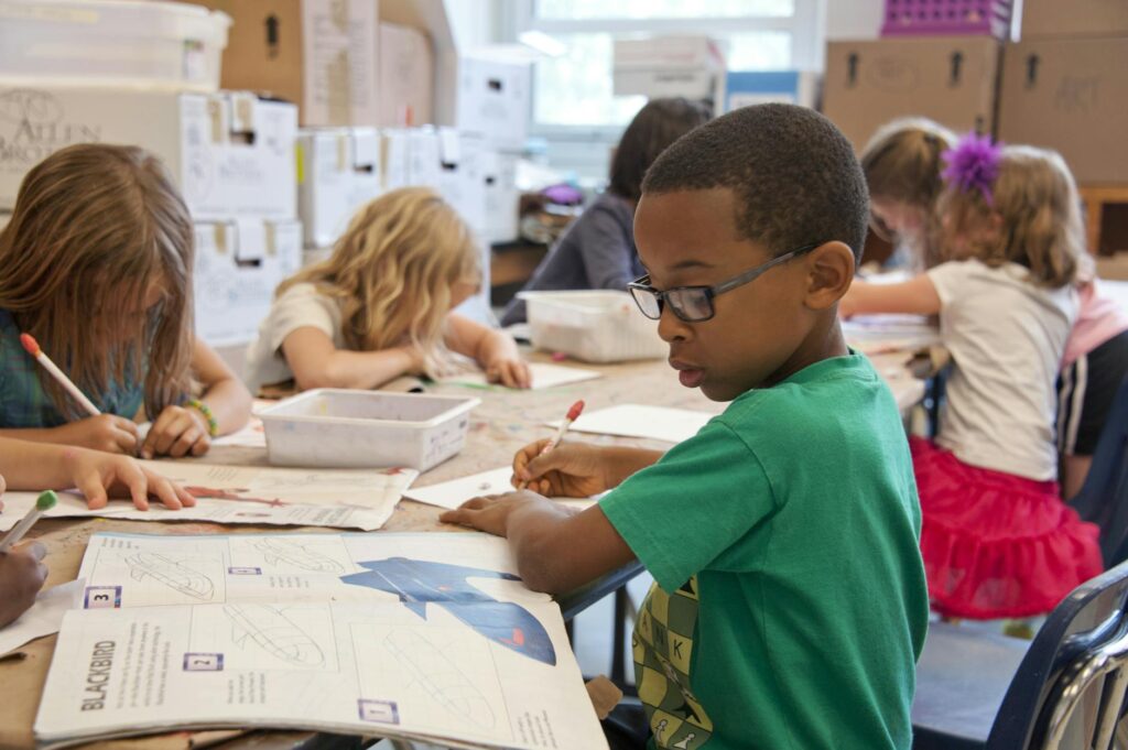 children drawing in classroom