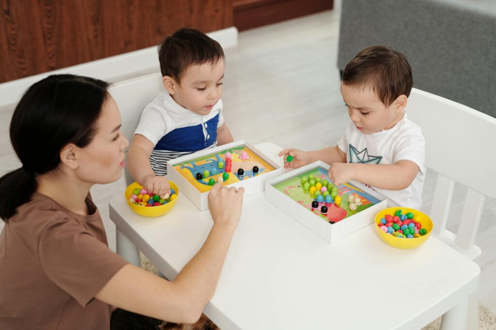 children playing educational board game