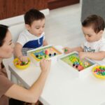 children playing educational board game