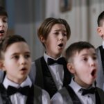 children singing christmas carols classroom