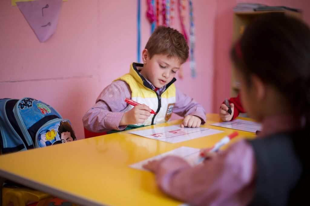 pupils playing educational games in classroom