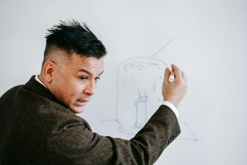 teacher drawing on whiteboard