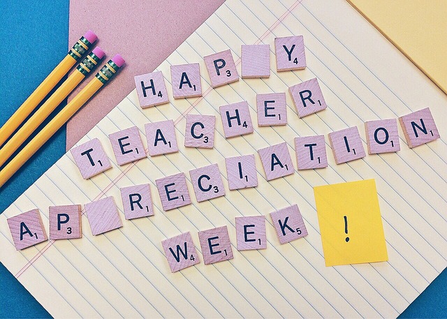 Teacher warmly greeting middle school students at classroom door (best teaching strategies for middle school students)